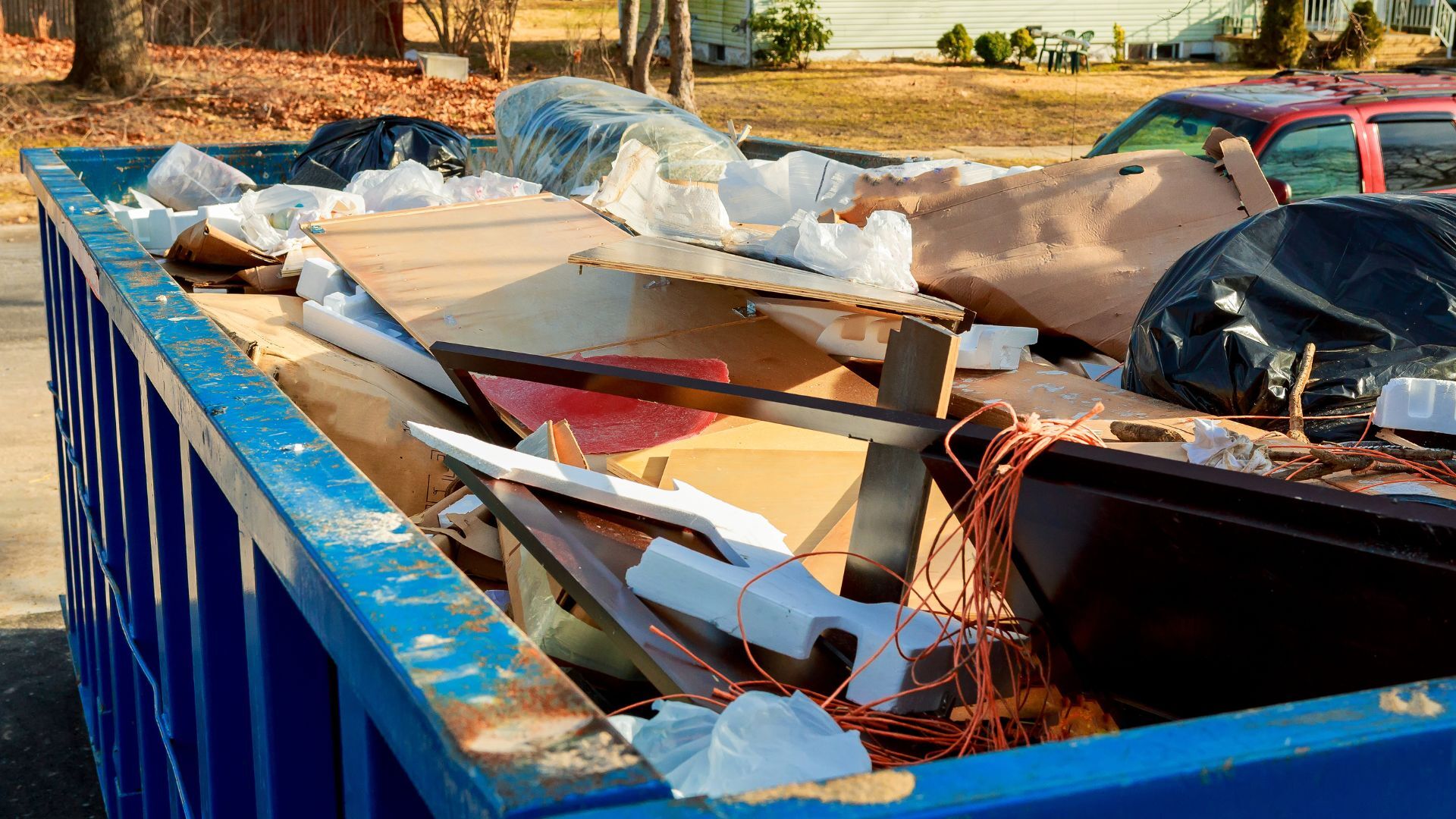 Container filled with household debris ready for hauling