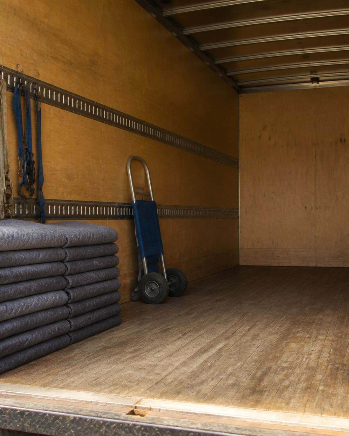 Moving blankets and straps prepared inside a truck for a long haul