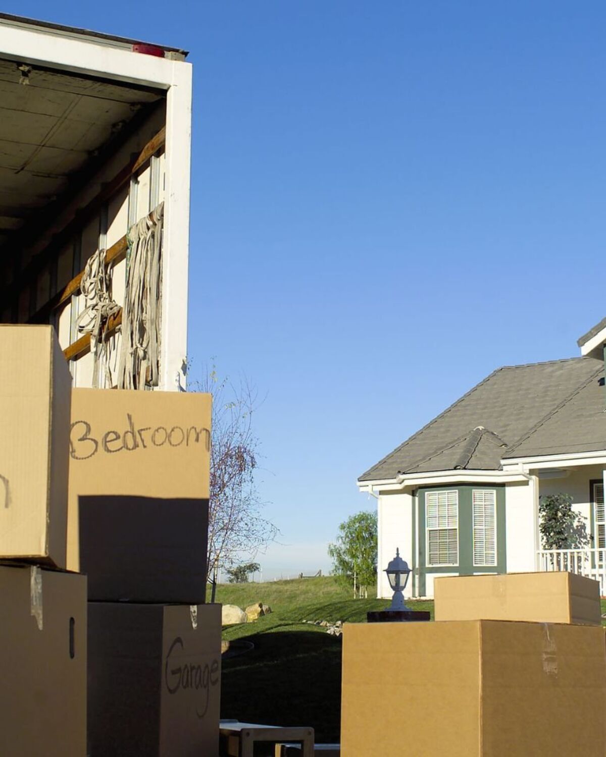 Loaded moving truck outside a Concord, NH home that has sold