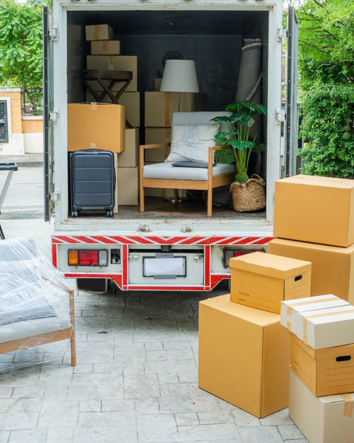 Moving truck backed into a driveway ready for a short-notice load